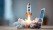 © Daniel - Rocket launching out of laptop with smoke and fire, symbolizing innovation and tech startup growth.