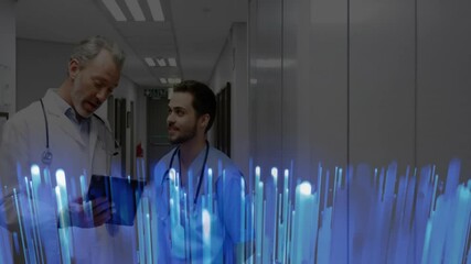 Poster - Younger doctor pausing along hallway as senior doctor projecting hologram medical data from tablet