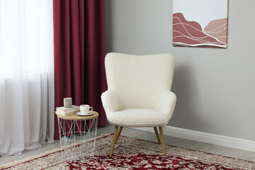 Aufkleber - Living room with armchair and burgundy color curtains. Interior design