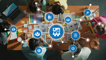 Poster - A dynamic workspace showing a diverse team engaged in creative management strategies using colorful charts and innovative tools, emphasizing collaboration and productivity. Amity