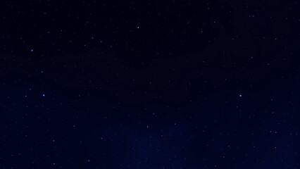 Wall Mural - Dark blue galaxy space background. Glowing stars in the night. Starry sky. New Year Christmas Celebration background concept.