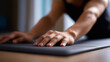 © Curioso.Photography - Close-up of person doing plank exercise on yoga mat focusing on hands and arms.