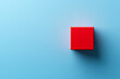 © photo for everything - Vibrant red cube casting a shadow on a calming blue surface. Simplicity and contrast define this compelling minimalist composition.