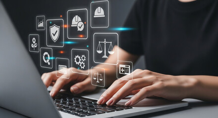 Aufkleber - Person typing on a laptop with digital icons floating above the keyboard and hands in the foreground