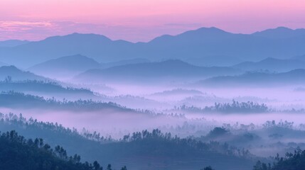 Poster - Sunrise Brings Pastel Hues to a Foggy Mountain Landscape, Creating a Tranquil Atmosphere Over the Serene Hills in the Early Morning Light
