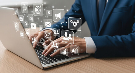 Aufkleber - Businessman typing on laptop with digital marketing icons floating above the keyboard and desk surface