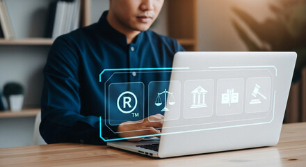 Aufkleber - Person using laptop with legal icons overlayed for trademark and intellectual property research online