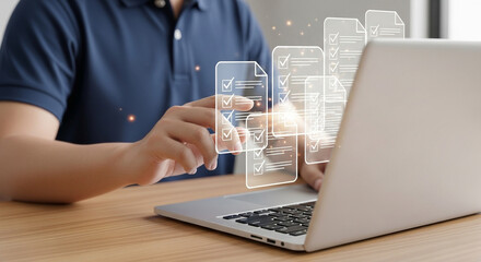 Poster - Man using laptop with digital checklist icons hovering above the keyboard on a wooden desk