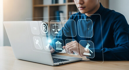 Poster - Man using laptop with floating legal icons representing intellectual property rights online access