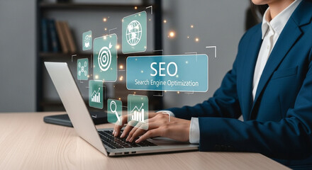 Poster - Person typing on laptop with seo icons overlayed in a business office environment setting visible