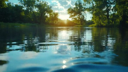 Poster - Tranquil River Scene: A serene river flows gently, reflecting the clear blue sky and the lush greenery of the surrounding trees, creating a peaceful and idyllic landscape.