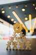 © sommart - Employees form a protective pyramid, topped by the insurance symbol, signifying group insurance as the foundation of their security.