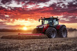 © inas - Modern red tractor harvesting field during vibrant sunset on farmland with dramatic sky and dust trail