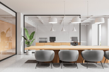 Poster - Modern conference room with gray chairs, wood table, and glass walls in bright minimalist office interior with pendant lights and potted plant decor. 3D Rendering