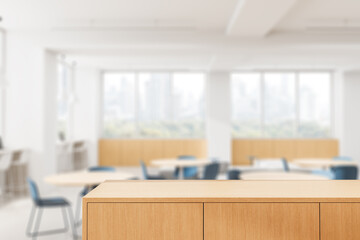 Poster - wooden tabletop in focus with modern office interior blurred in background for product display or mo