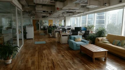 Poster - Modern Office Interior with Comfortable Seating, Desks, and City Views
