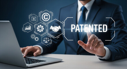 Poster - Businessman using laptop with patented graphic overlay and business related icons displayed digitally