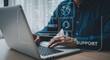 © mod - Person typing on laptop with support icons representing technical assistance and customer service