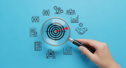 Poster - Hand holding magnifying glass over target with arrow surrounded by business icons on blue background