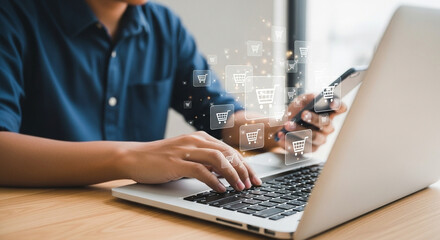Poster - Person using laptop and phone with shopping cart icons floating above the keyboard and the phone screen