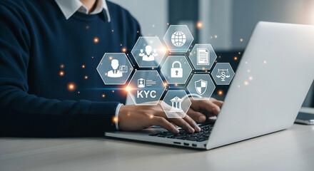 Poster - Person typing on laptop with kyc and security icons hovering above the keyboard in a digital overlay