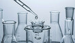 © Obsure - Dropping liquid into clear glass beaker, Dropping liquid into lab glass containers