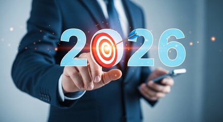 Poster - A businessman pointing at the year with a target and arrow representing the year twenty twenty six