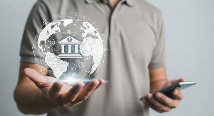 Poster - Man holding digital globe with bank icon and smartphone representing global finance technology