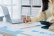 © Nittaya - Financial Analysis with Laptop and Charts