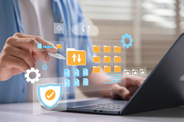 Fototapete - Digital file management and cloud storage system with user using stylus to organize secure folders and upload data on laptop interface for productivity, cybersecurity and document backup