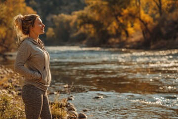 Poster - Attractive woman in casual wear admiring landscape along River Drava during golden hour at dusk in Slovenia