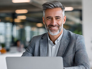 Poster - Business Professional Smiles While Working on Laptop in a Modern Office Environment During Daytime