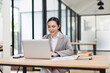 © David - Asian businesswoman Accounting using calculating income-expenditure and analyzing real estate investment data report Financial and tax systems concept.