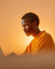 Poster - Remote Work Lifestyle Focused Black Man Using Laptop and Writing in Notebook at Home Office with Warm Minimalist Aesthetic for Freelance and Online Education