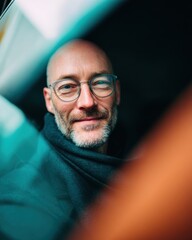 Aufkleber - Modern Location-Independent Middle-Aged Man with Glasses Smiling in Vehicle Interior for Mobility and Freelance Work Branding