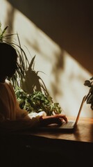 Poster - Modern real estate professional working on laptop with natural light and plants in eco-friendly office space for sustainable property marketing