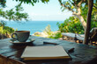 © xadartstudio - Ocean view coffee break notepad and pen ready for writing notes