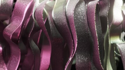 Poster - Purple and silver ribbons waving gracefully, intertwining with elegant metallic sheen and creating dynamic abstract visual composition against pristine white backdrop