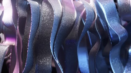Poster - Metallic ribbons with iridescent shimmer gently undulating, weaving luminous blue and purple hues into a hypnotic visual choreography of fluid motion and elegant design