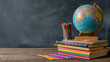 © Photo Hub - Back to School Concept. Earth Globe, Books, Notebooks, Colorful Stationery. Education and School Supplies. Blackboard Chalkboard Background for Learning. Stack of Books and.