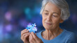 © Kateryna - Elderly Woman with Brain Puzzle Piece Promoting Alzheimer's Awareness