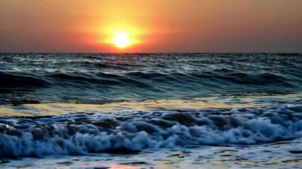 Wall Mural - sunset over the ocean with waves crashing in front of it