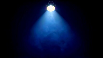 Wall Mural - a close up of a light shining on a stage with a black background