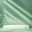 © EvgeniiasArt - Empty product podium mockup for advertising card template presentation on green wall background with lights and shadows, studio setting display