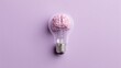 © Neon Stock - Ultra quality image of light bulb with human brain model inside on isolated pastel purple background. Top view, minimal flat lay. Concept of creative ideas, innovation, invention.