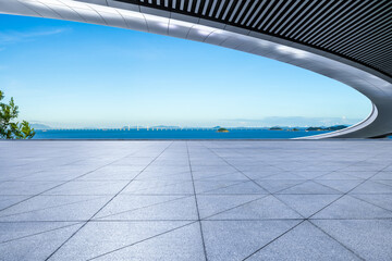 Wall Mural - empty square floor and bridge with blue sea scenery under blue sky