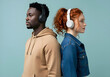 © Autism in Focus - Neurodivergent autistic couple back to back wearing headphones with colorful background celebrating individuality