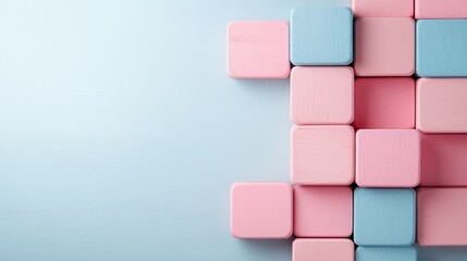 A creative arrangement of colorful wooden blocks in pink and blue hues against a soft background, ideal for abstract concepts and showcasing artistic imagination.