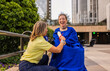 © PintoArt - Teacher congratulating disabled student after graduation ceremony