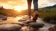 © svastix - A person stepping gracefully across smooth stones in a tranquil stream during sunset, encapsulating the essence of adventure and connection with nature's beauty.
